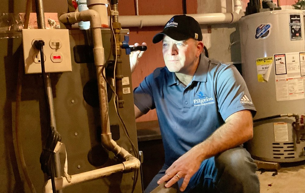 Daniel Terrell inspecting a furnace